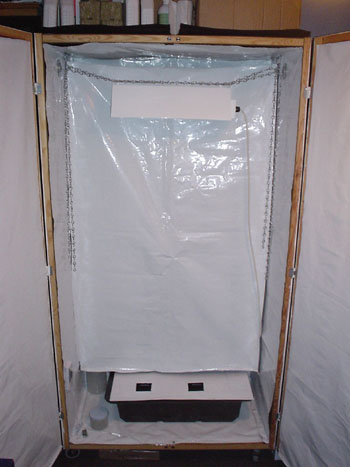 When somebody wants to see inside the cupboard but I don't want them, to see my skunk plants, like my mum, I attach this sheet to hide them, then only the strawberry plants are visable.